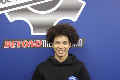 Person smiling in front of Beyond the Board logo.